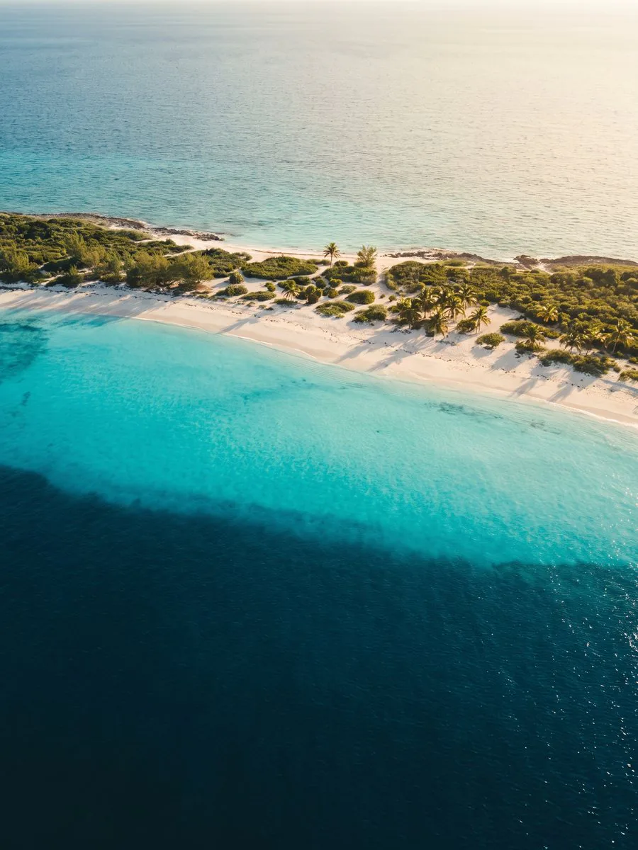 Turquoise water and white sand shoreline in the Bahamas